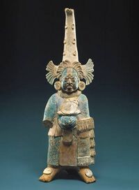 "The garment worn by this figure is believed to represent the quilted armor worn by warriors, but the elaboration of the costume and its accoutrements suggest a figure of high rank and noble status." Costumed Figure, 7th–8th century -- Mexico; Maya Ceramic, pigment; H. 11 17/32 in. (29.3 cm) (1979.206.953) – Metropolitan Museum of Art Note the pectoral ("breast plate"). Note that this figure post-dates the Nephite period.